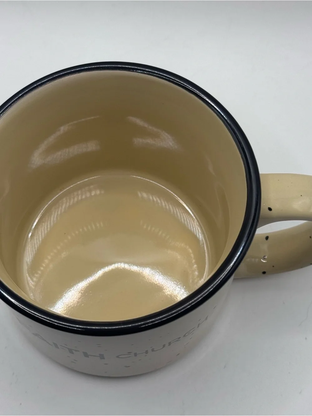 FAITH CHURCH Yellow Campfire Coffee Mug with Black Specks And Black Rim